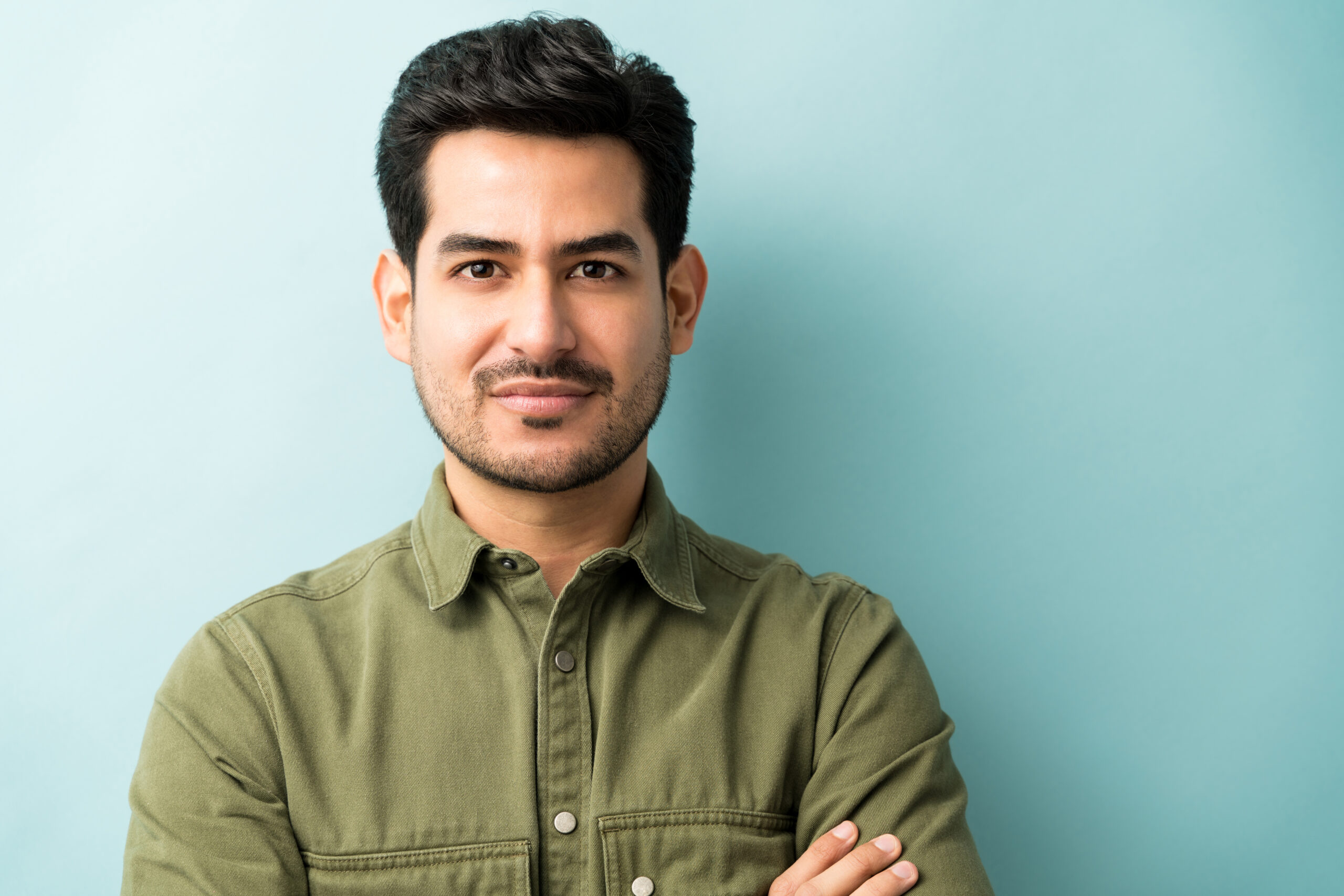 man standing against blue background